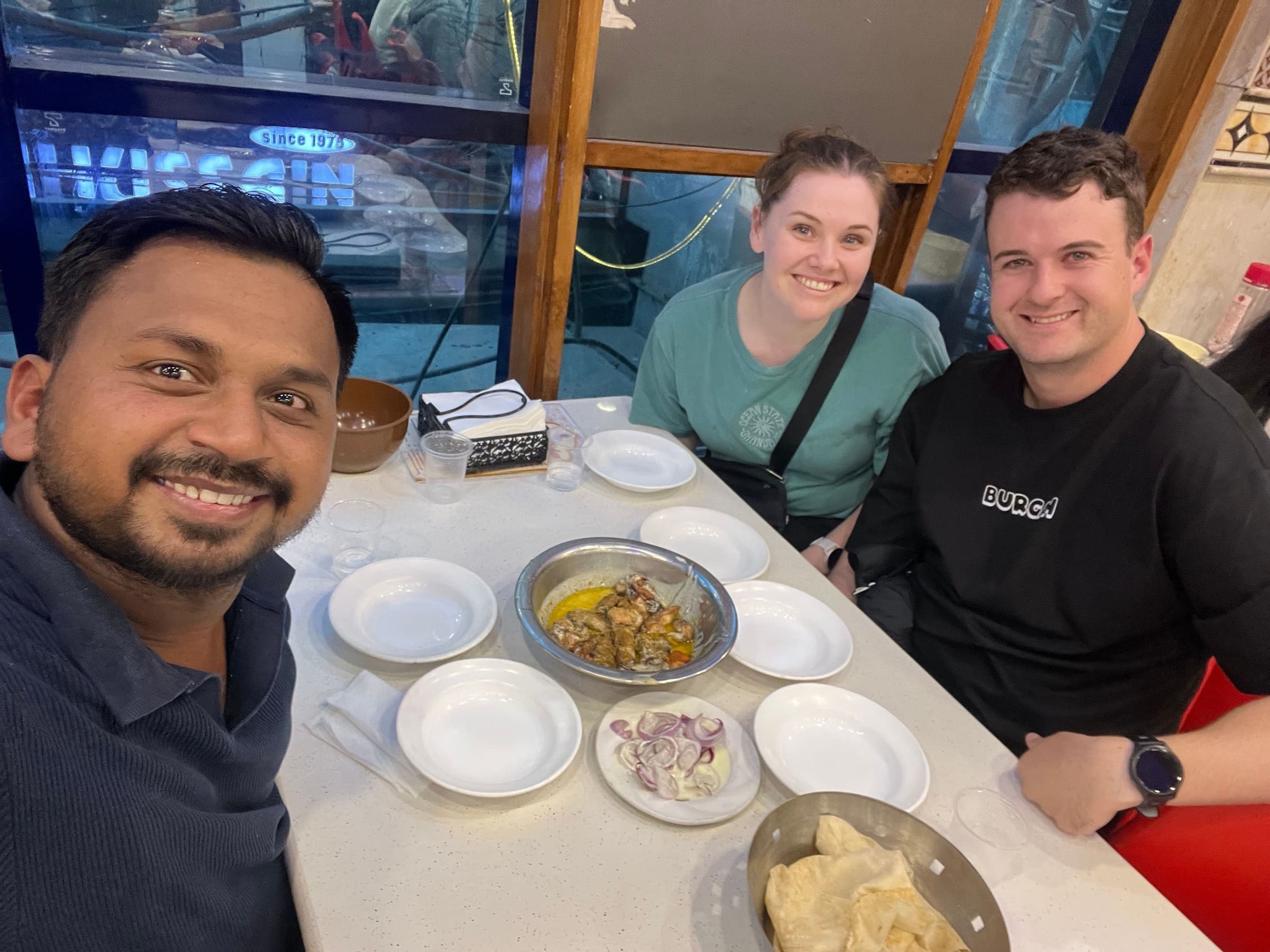 Rahul, founder and lead guide of Old Delhi Food Tours, sharing a meal with guests